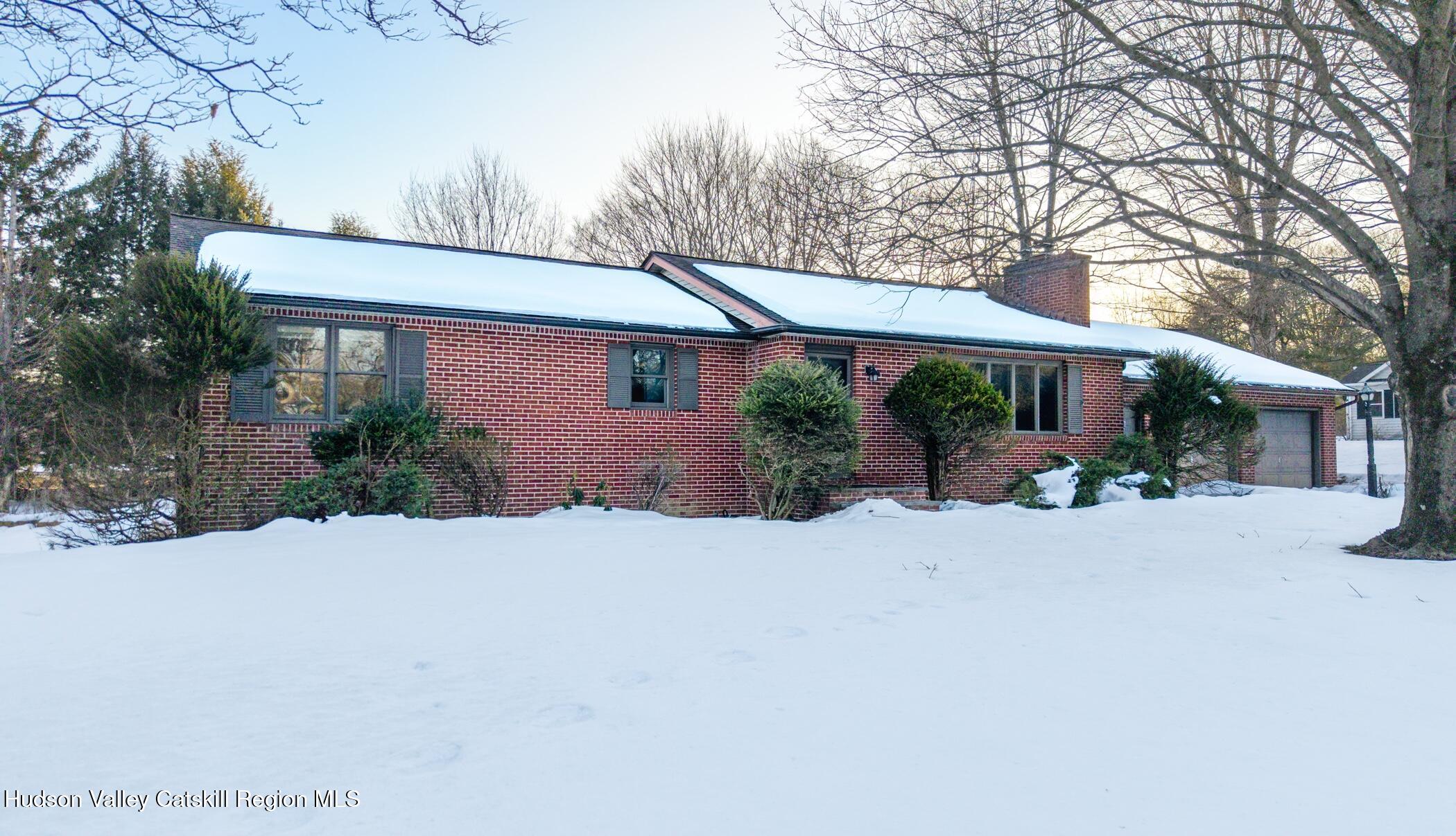 609 New Paltz Road Highland, NY 12528 - Photo 30 of 35 a front view of a house with a yard and a garage