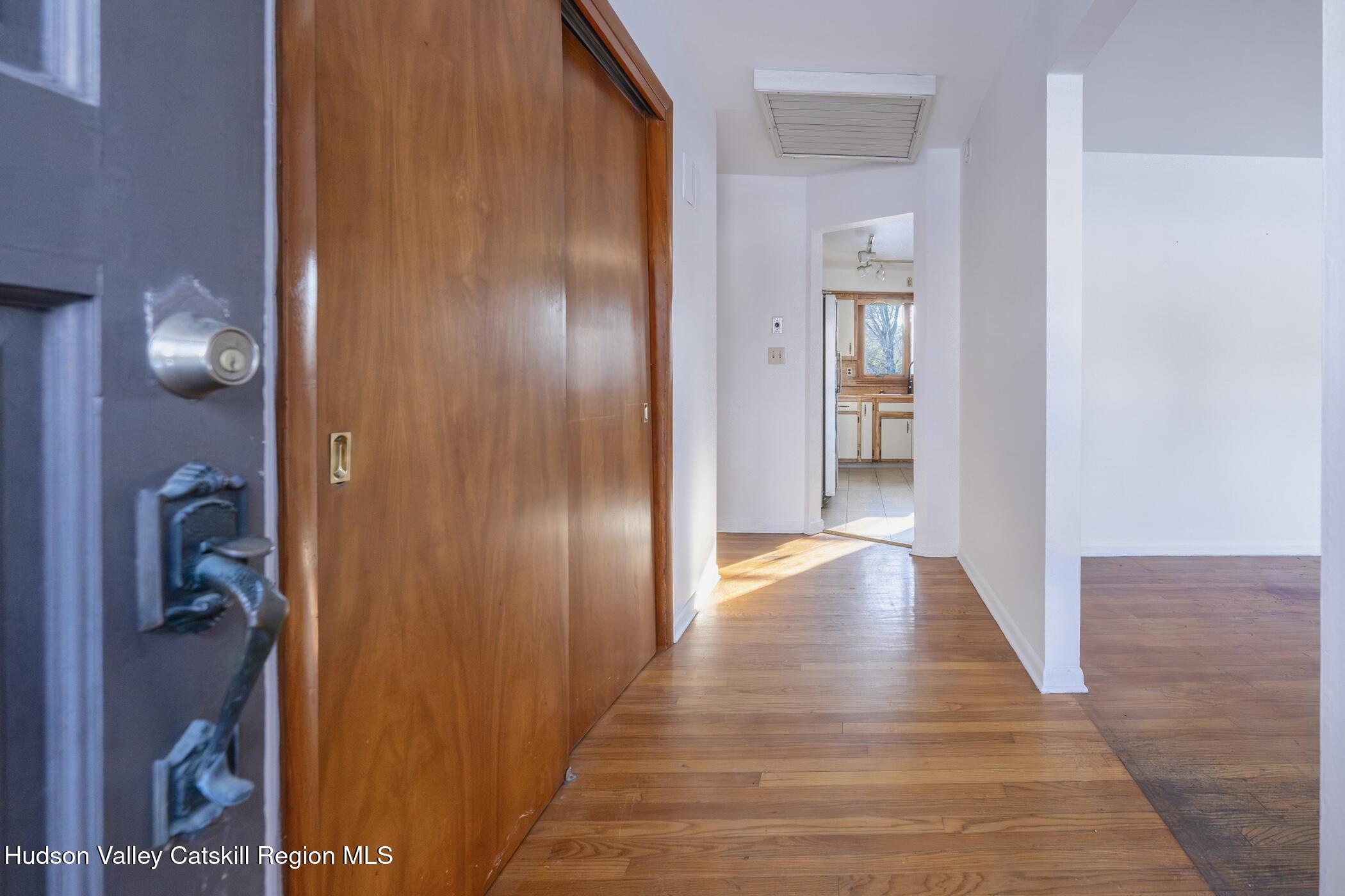 609 New Paltz Road Highland, NY 12528 - Photo 3 of 35 a view of a hallway with wooden floor