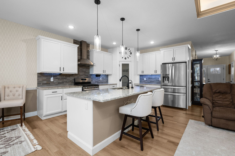 4418 Chestnut Drive Bettendorf, IA 52722 - Photo 17 of 45 a kitchen with white cabinets and refrigerator