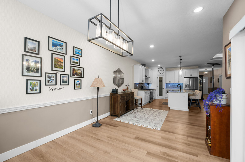 4418 Chestnut Drive Bettendorf, IA 52722 - Photo 22 of 45 a view of a living room and kitchen with stainless steel appliances