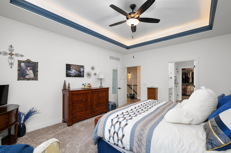 4418 Chestnut Drive Bettendorf, IA 52722 - Photo 24 of 45 a bedroom with a bed and a dresser