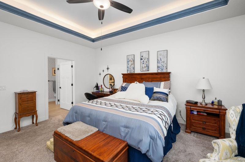 4418 Chestnut Drive Bettendorf, IA 52722 - Photo 25 of 45 a bedroom with bed and wooden floor