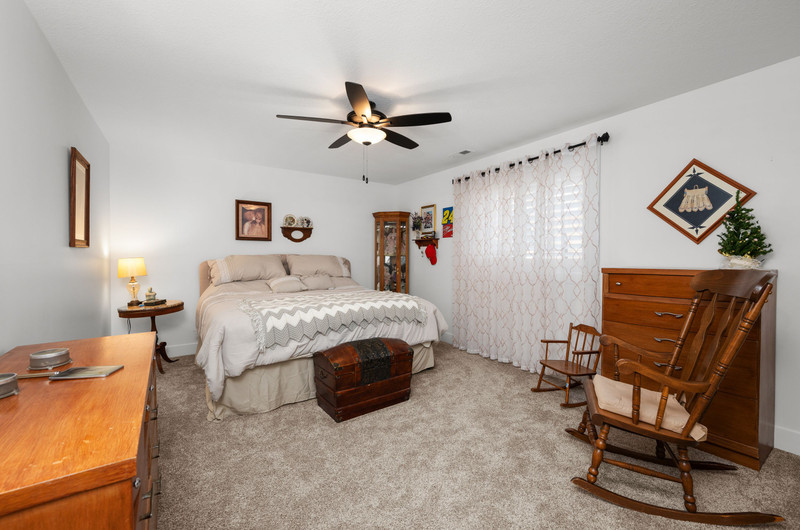 4418 Chestnut Drive Bettendorf, IA 52722 - Photo 29 of 45 a bedroom with a bed a desk and chair