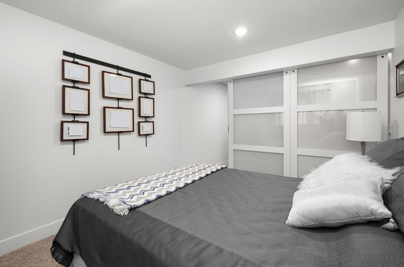 4418 Chestnut Drive Bettendorf, IA 52722 - Photo 36 of 45 a bedroom with a bed and painting on the wall