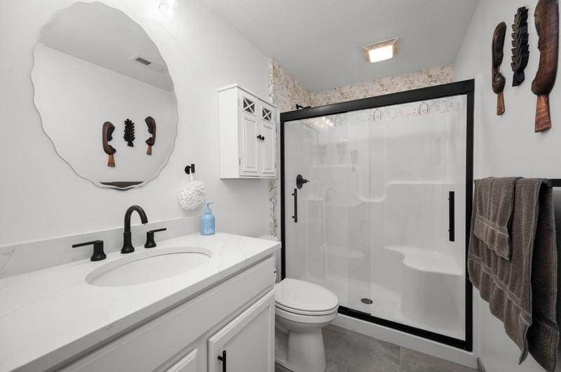 4418 Chestnut Drive Bettendorf, IA 52722 - Photo 40 of 45 a bathroom with a sink toilet and shower