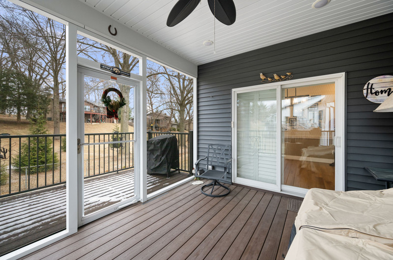4418 Chestnut Drive Bettendorf, IA 52722 - Photo 42 of 45 a view of a livingroom with wooden floor and iron stairs