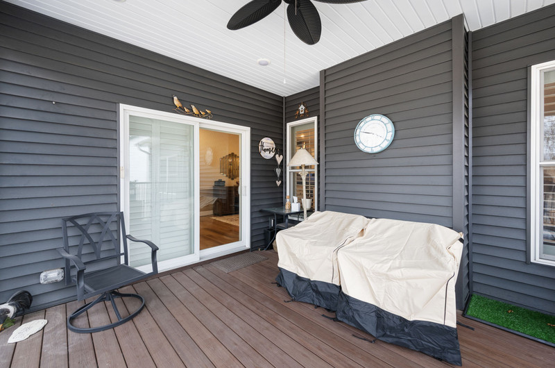 4418 Chestnut Drive Bettendorf, IA 52722 - Photo 43 of 45 a balcony with wooden floor table and chairs