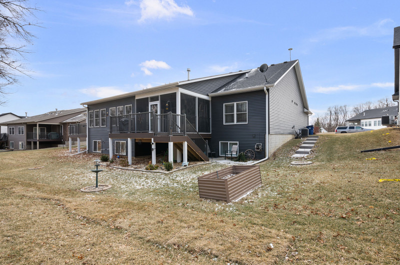 4418 Chestnut Drive Bettendorf, IA 52722 - Photo 44 of 45 a backyard of a house with table and chairs
