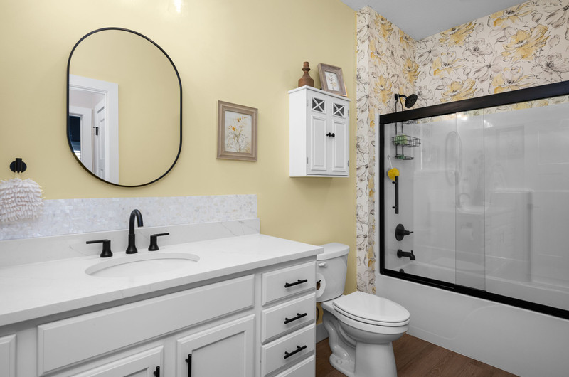 4418 Chestnut Drive Bettendorf, IA 52722 - Photo 9 of 45 a bathroom with a sink a toilet and shower