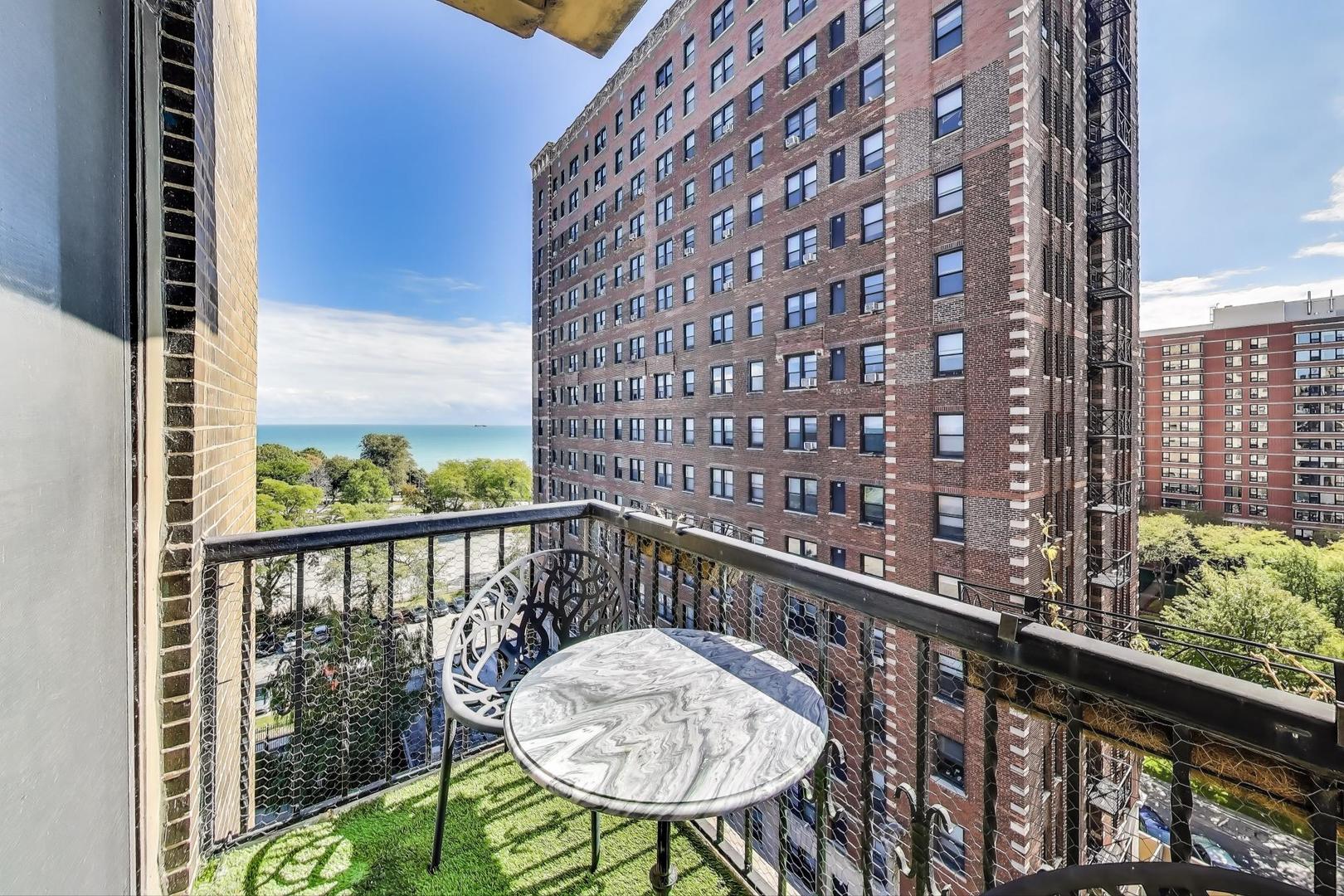 1765 East 55th Street, Unit J2 Chicago, IL 60637 - Photo 19 of 21 a view of a balcony with a table and chairs