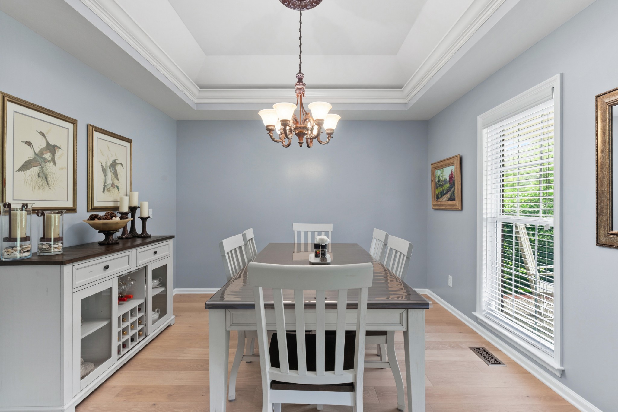 454 Campbell Hollow Road Bethpage, TN 37022 - Photo 12 of 57 a view of a dining room with furniture a chandelier and wooden floor