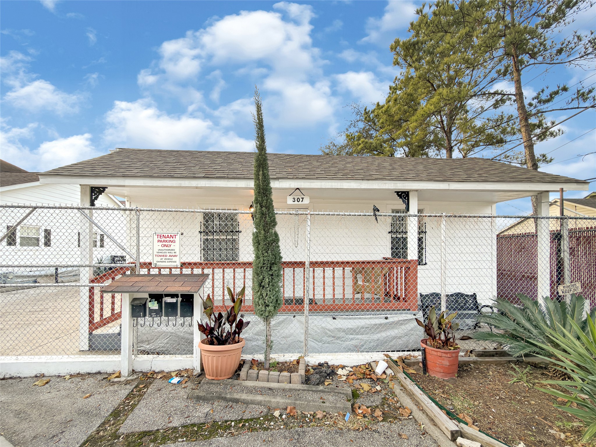 a view of a patio with couches chairs and potted plants