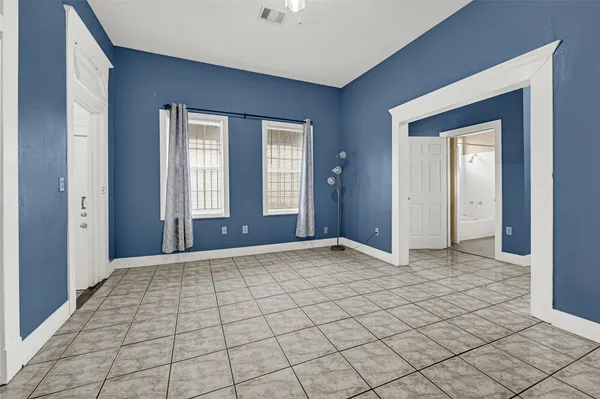 a view of an empty room and window