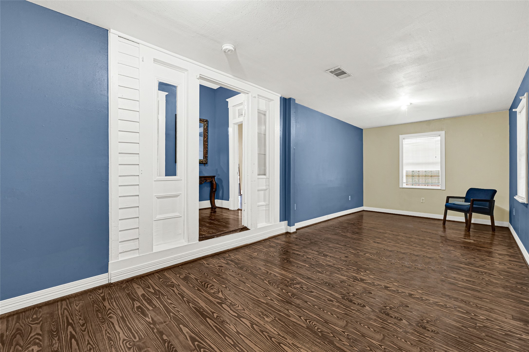 307 North Live Oak Street Houston, TX 77003 - Photo 5 of 15 a view of an empty room with window and wooden floor