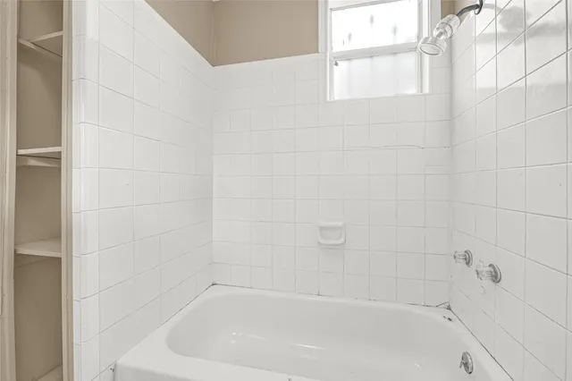 a close up of a bathtub curtain