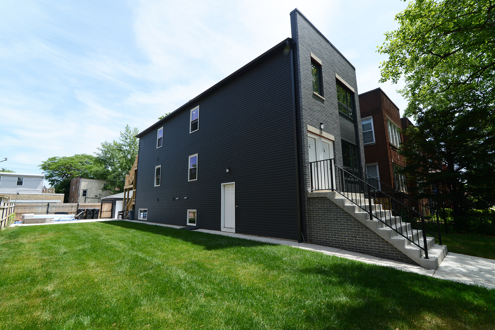 1051 North Springfield Avenue Chicago, IL 60651 - Photo 25 of 50 a backyard of a house with lots of green space
