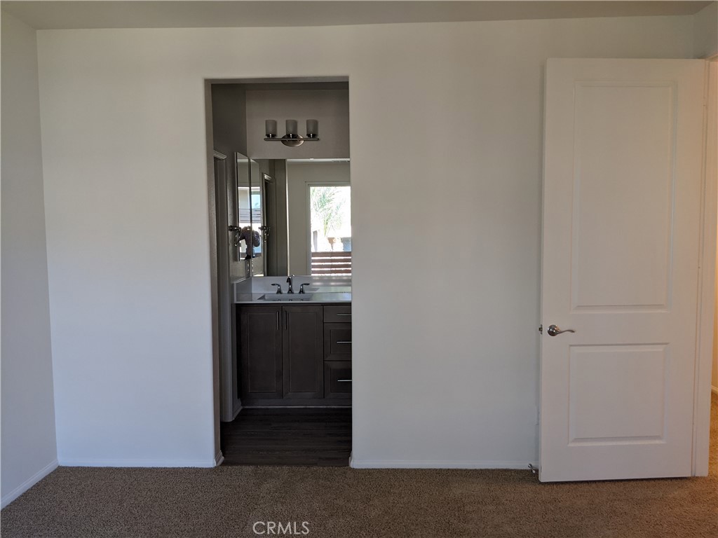 12248 Estrella Drive Rancho Cucamonga, CA 91739 - Photo 14 of 26 a view of a hallway and a livingroom with a window