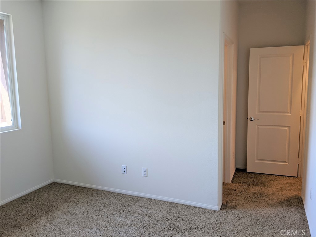 12248 Estrella Drive Rancho Cucamonga, CA 91739 - Photo 22 of 26 an empty room with a window