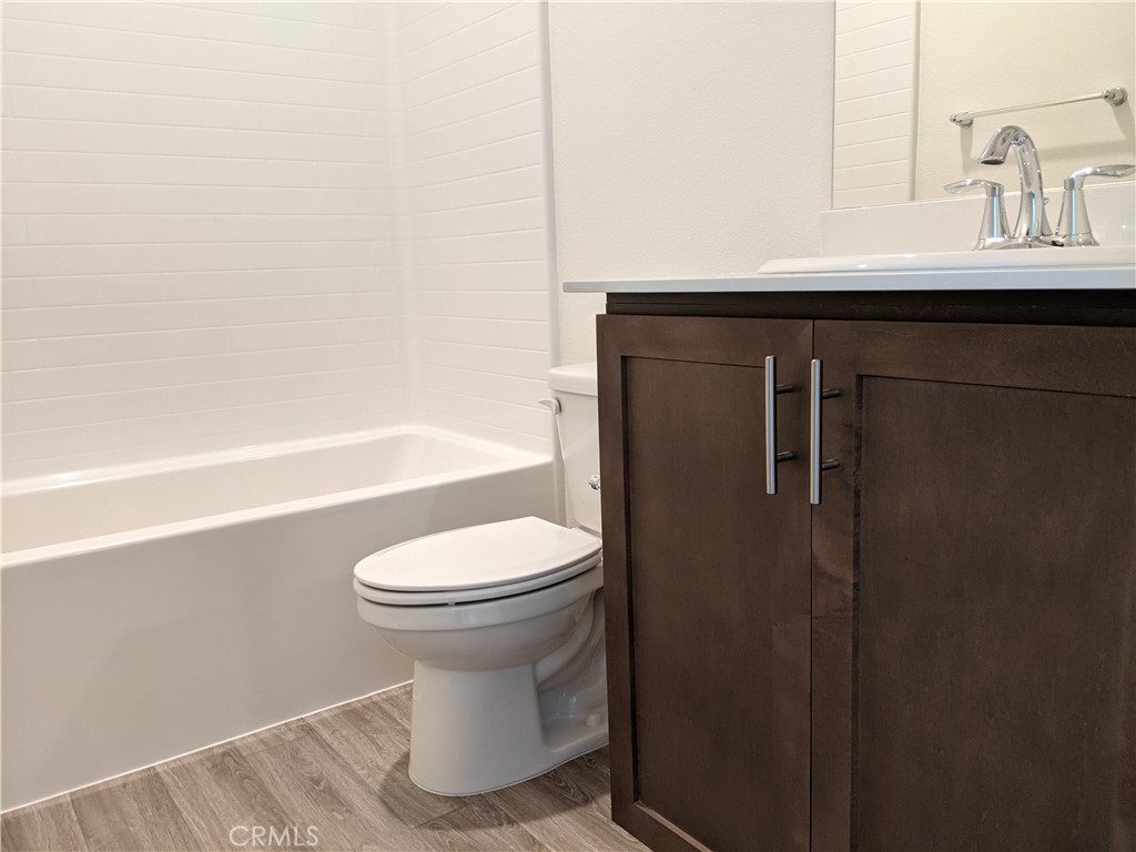 12248 Estrella Drive Rancho Cucamonga, CA 91739 - Photo 23 of 26 a bathroom with a sink toilet and shower
