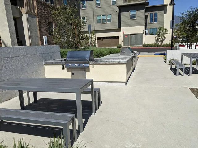 a view of a house with swimming pool and sitting area