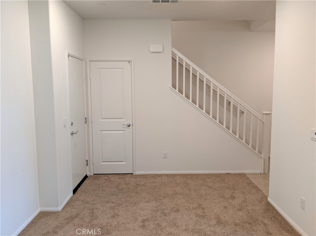 12248 Estrella Drive Rancho Cucamonga, CA 91739 - Photo 5 of 26 a view of a hallway with staircase