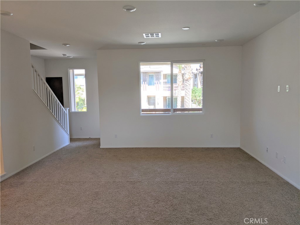 12248 Estrella Drive Rancho Cucamonga, CA 91739 - Photo 9 of 26 an empty room with windows