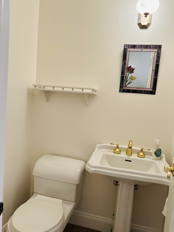 23 Case Drive Little Compton, RI 02837 - Photo 22 of 24 a bathroom with a toilet sink and mirror