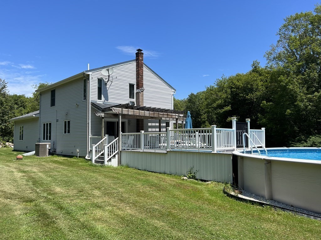 23 Case Drive Little Compton, RI 02837 - Photo 3 of 24 a view of a house with a backyard porch and sitting area