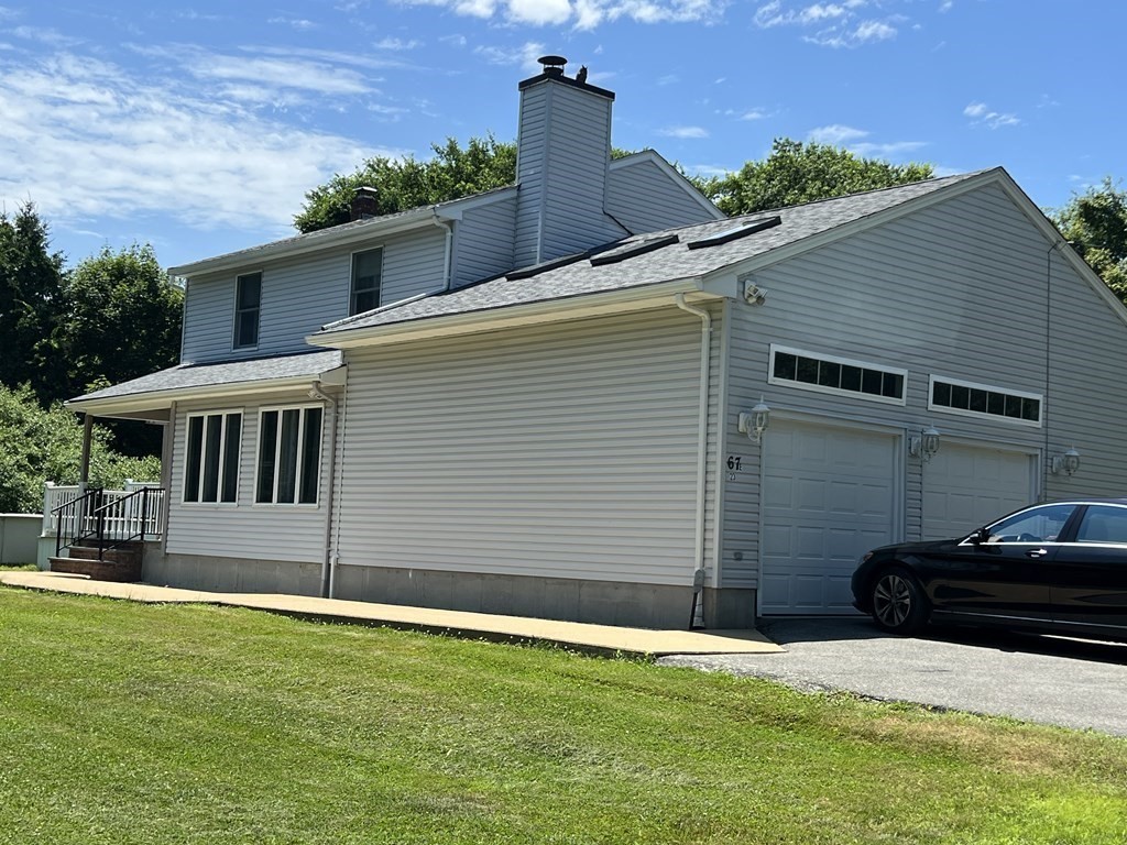 23 Case Drive Little Compton, RI 02837 - Photo 4 of 24 a front view of a house with a yard