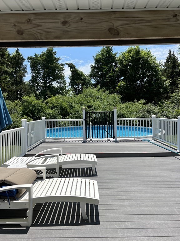 23 Case Drive Little Compton, RI 02837 - Photo 6 of 24 a view of a roof deck with wooden floor and fence