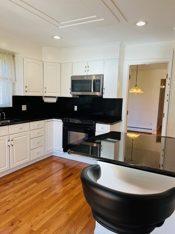 23 Case Drive Little Compton, RI 02837 - Photo 10 of 24 a kitchen with stainless steel appliances wooden floor and a sink