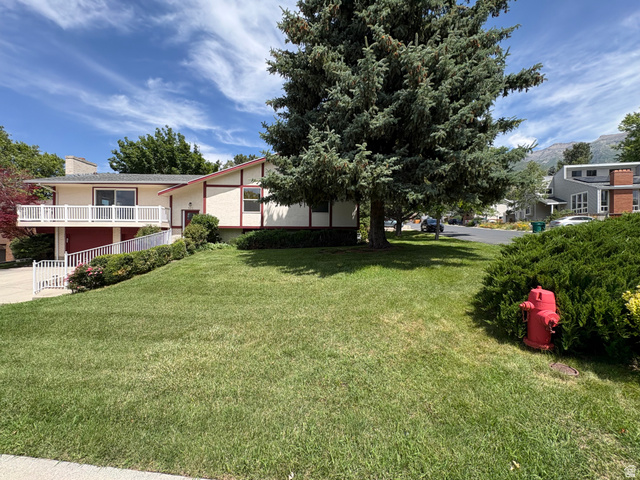 595 Meadowlark Road Orem, UT 84097 - Photo 86 of 87 Spacious front lawn with mature evergreen tree