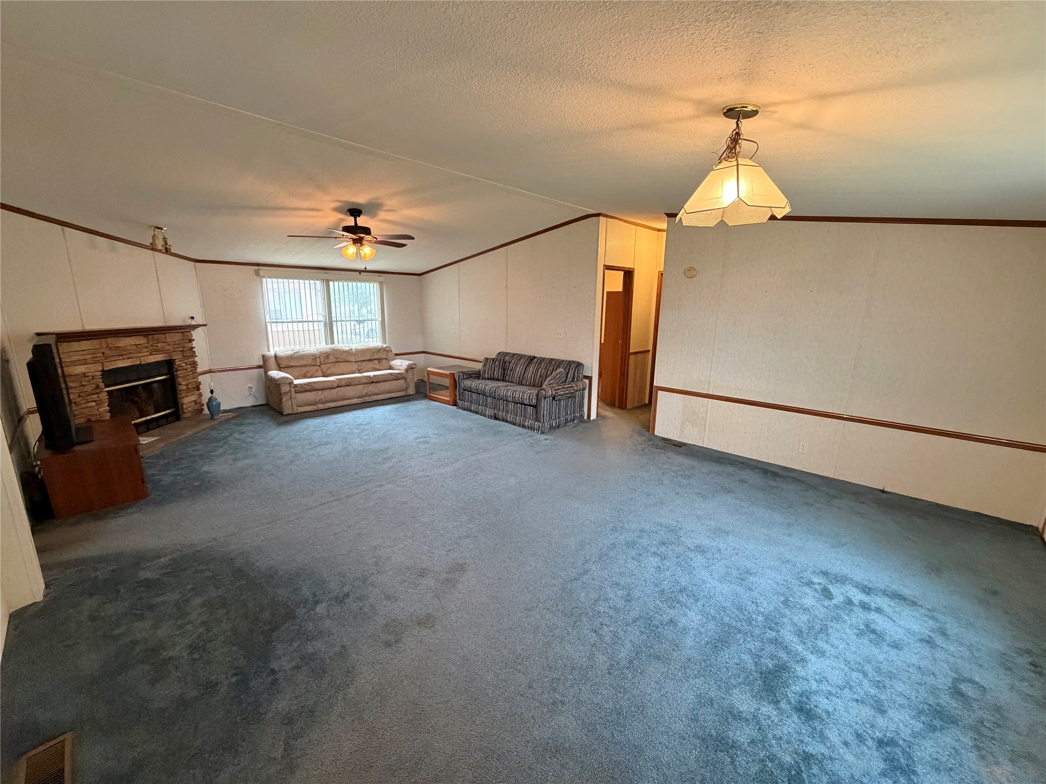 153 Prairie Lea Drive Angleton, TX 77515 - Photo 8 of 30 a view of a livingroom with furniture and a ceiling fan