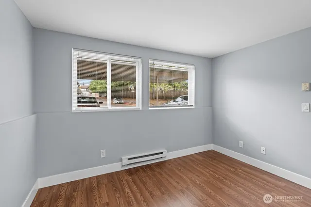 a bedroom with a bed and a chair