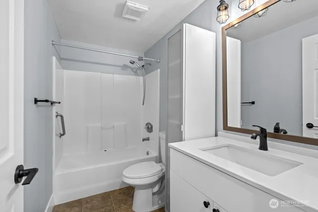 a view of livingroom with hardwood floor and a sink