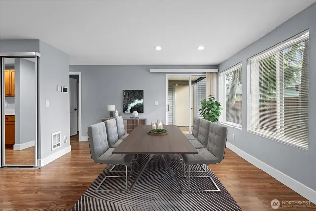 a view of an empty room with a fireplace and a window