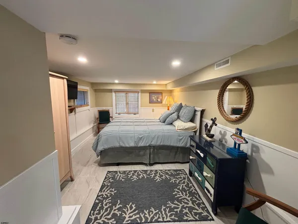 a kitchen with stainless steel appliances granite countertop a refrigerator a stove top oven a sink and dishwasher