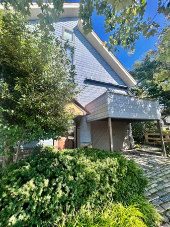 a view of a hallway with furniture and stairs