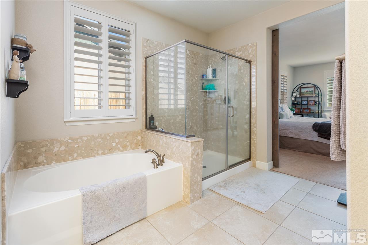 2940 Tobiano Drive Reno, NV 89521 - Photo 13 of 29 a spacious bathroom with a tub shower and window