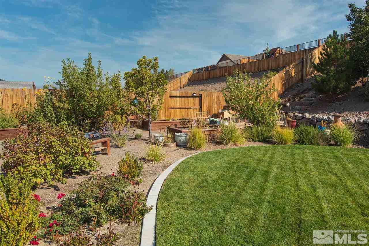 2940 Tobiano Drive Reno, NV 89521 - Photo 23 of 29 a view of a house with a yard