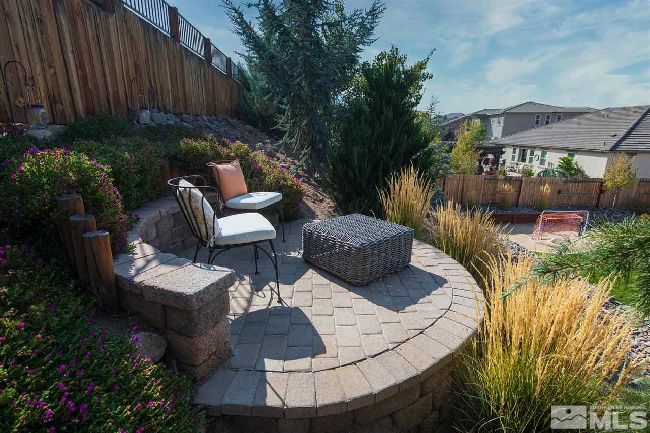 2940 Tobiano Drive Reno, NV 89521 - Photo 25 of 29 a view of a backyard with plants and outdoor seating
