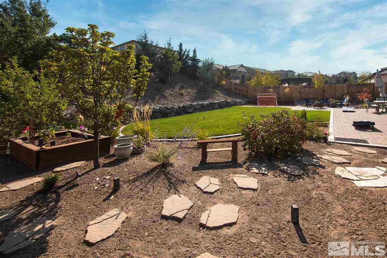 2940 Tobiano Drive Reno, NV 89521 - Photo 27 of 29 a view of a chairs and table in backyard