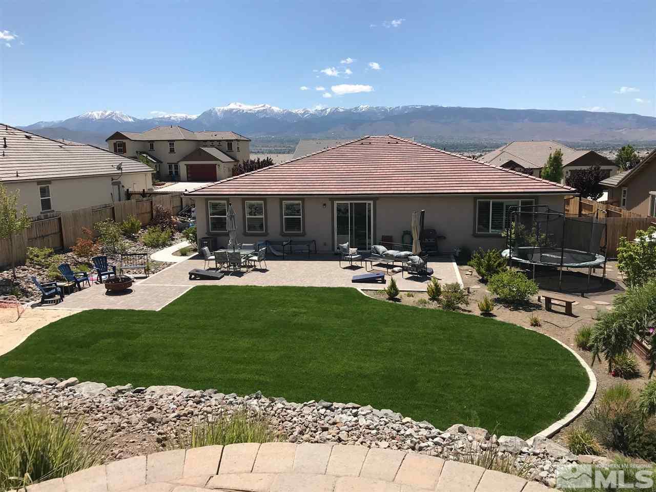2940 Tobiano Drive Reno, NV 89521 - Photo 29 of 29 a front view of a house with garden and sitting area