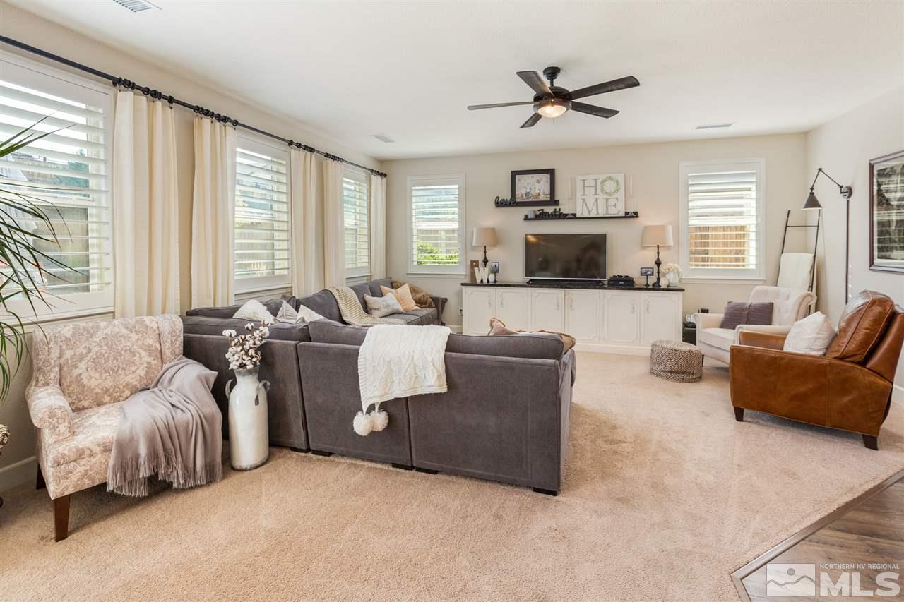 2940 Tobiano Drive Reno, NV 89521 - Photo 3 of 29 a living room with furniture fireplace and a large window