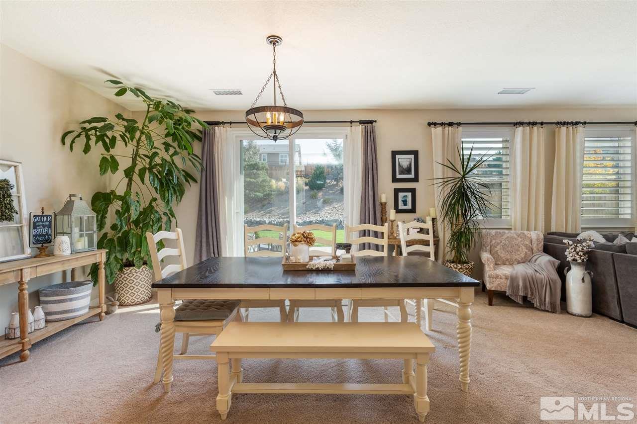 2940 Tobiano Drive Reno, NV 89521 - Photo 4 of 29 a living room with a couch and a potted plant