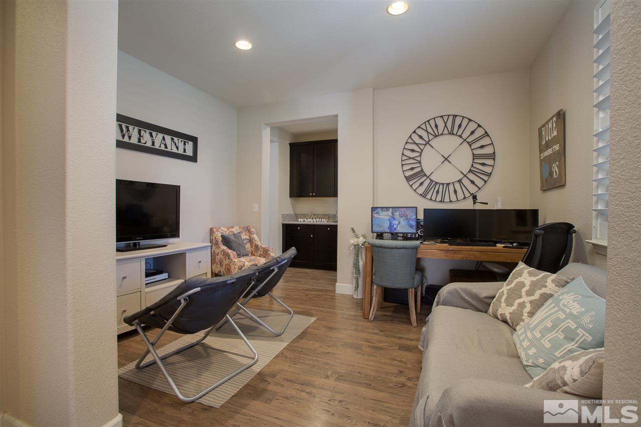 2940 Tobiano Drive Reno, NV 89521 - Photo 7 of 29 a living room with furniture and a flat screen tv