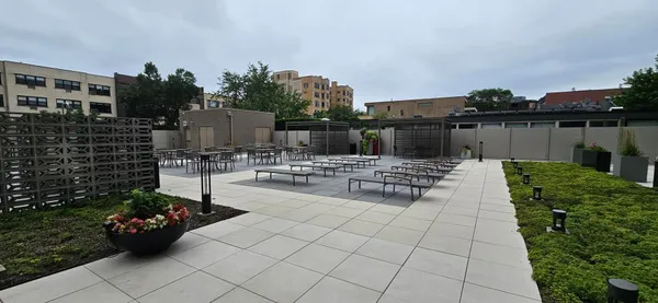 a view of a backyard with sitting area