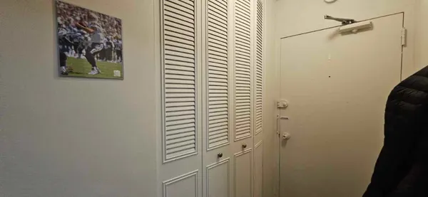 a bathroom with a shower and a sink