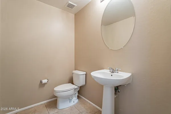 a bathroom with a sink a mirror and a toilet