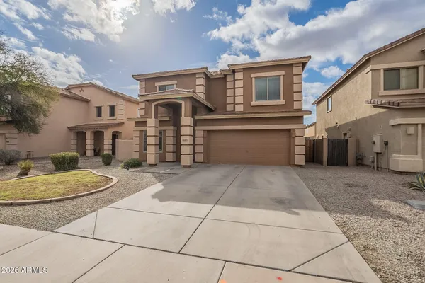 a front view of a house with a garage